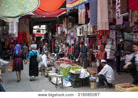 Kashgar, Xinjiang, China - August 14, 2012: People At A Street Market In The City Of Kashgar, Xinjia