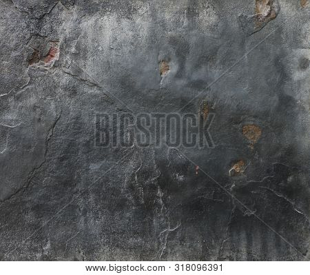 Black And Grey Natural Raw Stone Walls In The Background Without People, Close-up
