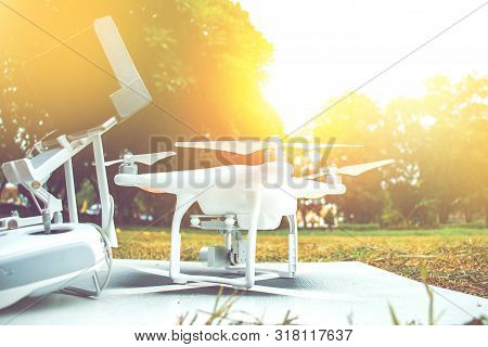 White Camera Drone Standby For Take Video In Tv Documentary Beside With Remote Controller