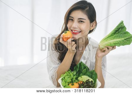 Beautiful Asian woman with healthy food. Heathy life style and Beautiful skin care food concept.