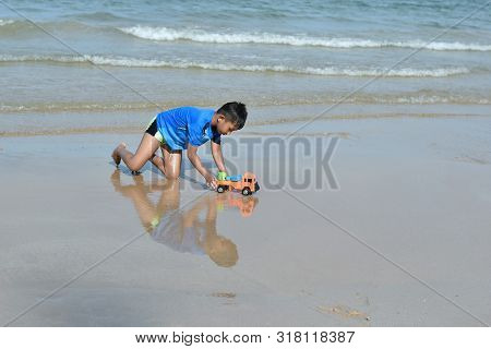 Hin Ngam Beach, Nakhon Si Thammarat Province, Thailand -13 April 2019: Asian Boys Playing In The Sea