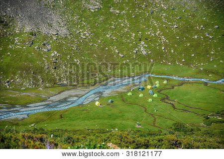 Dyllic Summer Landscape With Hiking Trail In The Mountains With Beautiful Fresh Green Mountain Pastu