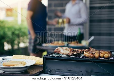 Close Up Grill With Meat And Sausage Ready For Socializing Celebrate With Friends At Outsite Home.
