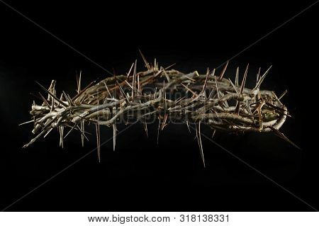 Crown of thorns with dramatic light isolted over dark background
