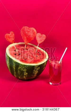 Useful Watermelon Juice With A Tube And A Large Ripe Watermelon Decorated With Hearts On Sticks On A