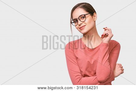Horizontal European Young Woman Smiling, Wearing Pink Long Sleeve Shirt And Transparetn Eyeglasses, 