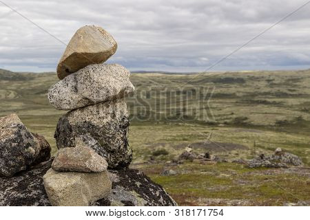Stones Stacked For Norwegian Fairytale Trolls. Relief And Texture Of Stone With Patterns And Moss. S