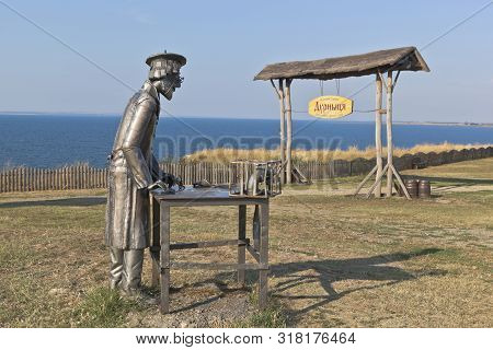 Taman, Temryuk District, Krasnodar Region, Russia - July 17, 2019: Statue Of A Furrier At The Gate T