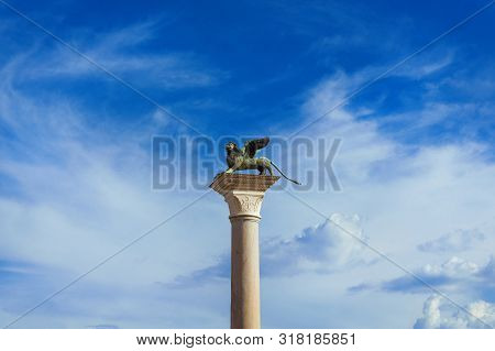 Saint Mark Winged Lion Medieval Statue, A Symbol Of The Old Venice Republic, At The Top Of An Ancien