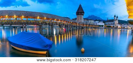 Water Tower, Wasserturm, Jesuit Church And Chapel Bridge, Kapellbrucke Over The River Reuss At Night