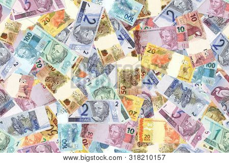 Motley Background From Chaotically Scattered Brasil Reals Banknotes Abstract Seamless Geometrical Pa