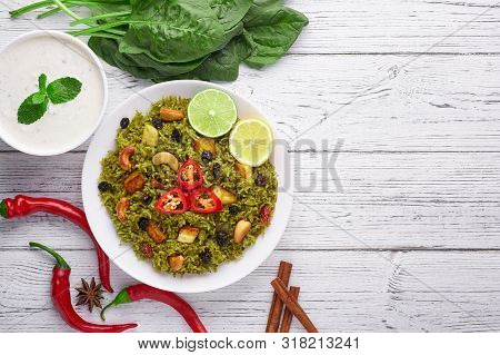 Palak Paneer Biryani At White Wooden Background. Palak Paneer Biryani Is Vegetarian Indian Cuisine D