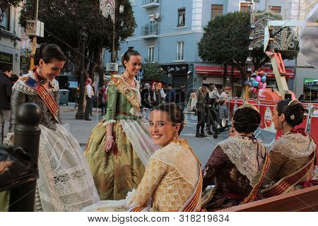Valencia, Spain- March 12, 2018: Women Falleras Majors Of Valencia Chatting, Dressed In The Typical 