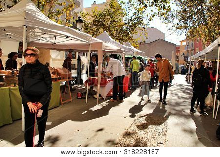 Elche, Alicante, Spain- December 1, 2018: People Buying In The Local Ecological Market In The Main S