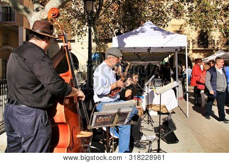 Elche, Alicante, Spain- December 1, 2018: Musicians Playing At The Local Ecological Market In The Ma