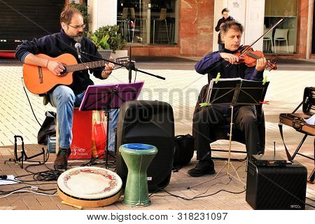 Elche, Alicante, Spain- December 1, 2018: Musicians Playing At The Local Ecological Market In The Ma