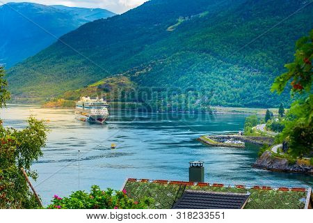 Flam, Norway - July 31, 2018: Norwegian Fjord Sognefjord Landscape And Aidaluna Cruise Ship