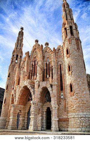 Novelda, Alicante, Spain- November 28, 2018: Details, Archs, Tower And Tiles Of Sanctuary Of Santa M