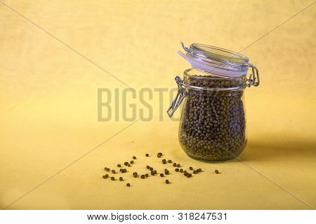 Mung Bean In A Jar On A Yellow Background. Copy Spaes. Horizontally