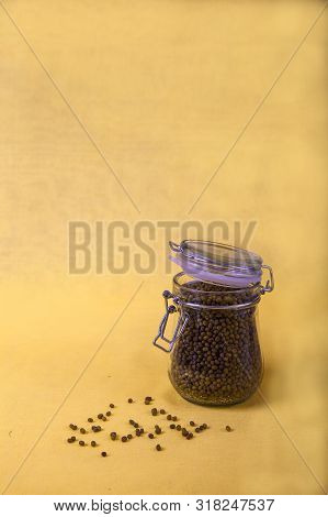 Mung Bean In A Jar On A Yellow Background. Copy Spaes. Vertical