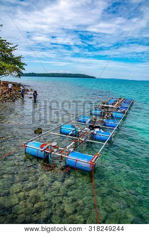 Workers Settle And Setup The Waterworks Fountain Machine On The Surface Of The Sea.