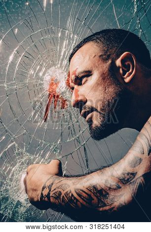 Man With Muscular Body Punching. Men Fashion Brutal Models. Handsome Brutal Man On Gray Background. 