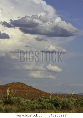 Southern Utah Summer Desert Storm Over A Red Sandstone Hill