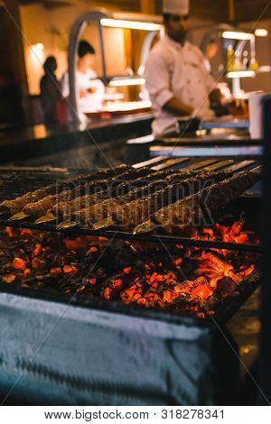 Frying Kebab On Fire In Hotel Kitchen