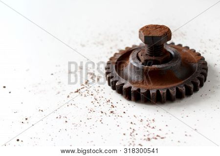 Rusty Bolt, Nut And Gear Wheel Made Of Chocolate Isolated On White Background. Chocolate Chip Scatte