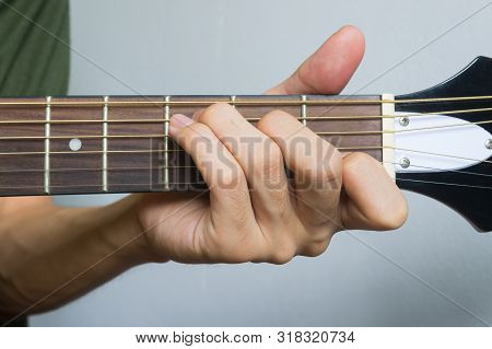 Guitar Player Hand Or Musician Hand In C Major Chord On Acoustic Guitar String With Soft Natural Lig