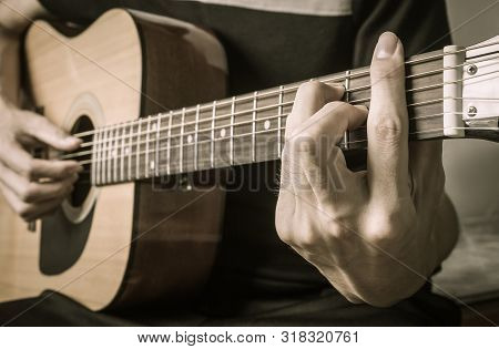 Guitar Player Hand Or Musician Hand In F Major Chord On Acoustic Guitar String With Soft Natural Lig