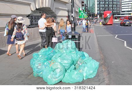 London England - June 2, 2019: Rubbish In Veolia Plastic Bag Piled In Downtown London Uk