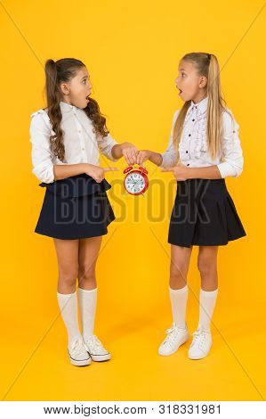 Schoolgirls And Alarm Clock. Children School Pupils. Knowledge Day. School Time. Surprised Shocked K