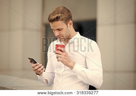 Send Message. Man Drinks Coffee Read Message Urban Background. Start Great Day. Businessman Relaxing