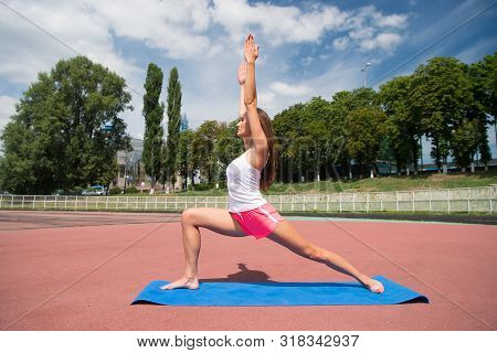 Fitness For Health Resolution. Sexy Fit Woman Developing Physical Fitness By Stretching. Athletic Gi