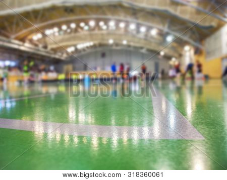 White Lines Painted On Green Inside Florr. Sporty School Hall. Players Out Of Focus.