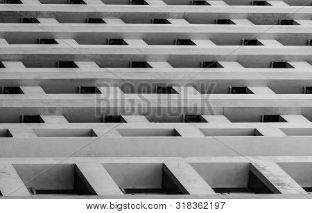 Bottom View Of Skyscraper Concrete Building. Looking Up View In Apartment Building In The City. Real
