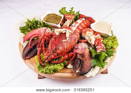 Mediterranean Cuisine, Lobster Stuffed With Cabbage, Greens And Sauces
