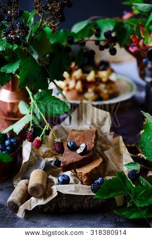 Norwegian Cheese Brunost On The Cutting Board .style Rustic.selective Focus