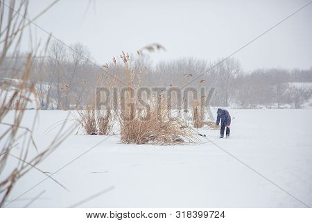 Ice And Fishing Rod For Winter Fishing. Winter Fishing. Small Catch Of Fish.