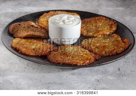 Potato Pancake. Draniki Dish With Sour Cream. Vegetable Fritter Baked For Vegetarian Kitchen German 
