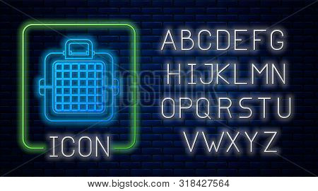 Glowing Neon Pet Carry Case Icon Isolated On Brick Wall Background. Carrier For Animals, Dog And Cat