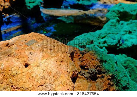 Two Tone Colors Of Rough Stone, Brick Red And Jade Green Colors, Closeup To The Surface, In The Unde