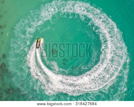 People Are Playing A Jet Ski In The Sea.aerial View. Top View.amazing Nature Background.the Color Of