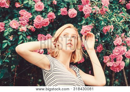 Girl Adorable Blonde Sniffing Fragrance Of Pink Bloom. Spring And Summer. Perfume And Cosmetics. Wom