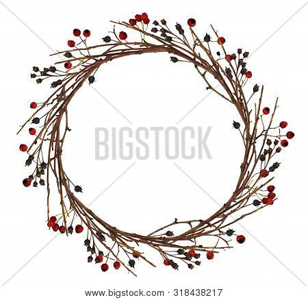Round Wreath From Dry Twigs And Yellow Autumn With Black And Red Berries Isolated On White Backgroun