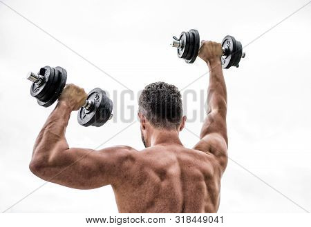 Muscular Back Man Exercising In Morning With Barbell. Fitness And Sport Equipment. Man Sportsman Wei