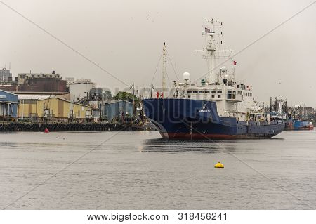 New Bedford, Massachusetts, Usa - August 22, 2019: Survey Vessel Kommandor Iona Passing Seafood Proc