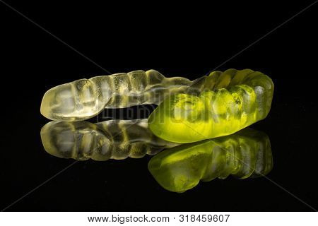 One Whole Green White Colourful Jelly Worm Candy Isolated On Black Glass