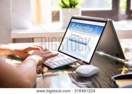 Laptop Showing Online Subscription Form On Screen
